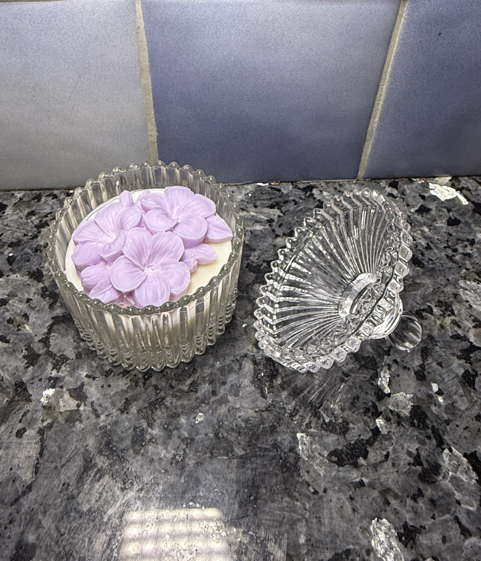 Lavender candle styled in a soft home-inspired scene